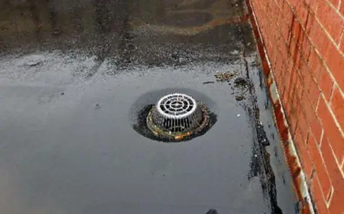 rain causing commercial roof leak water damage